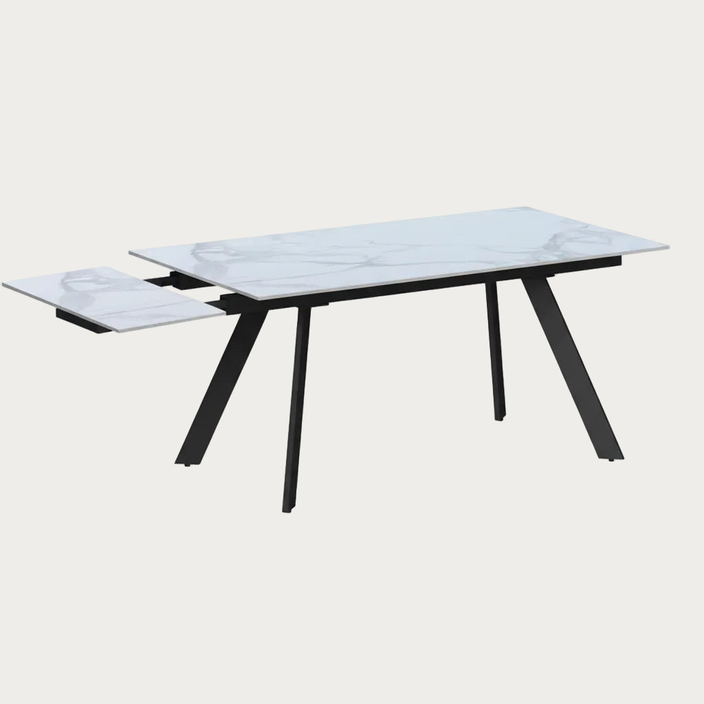 Alexandra modern dining table with glass top and black metal legs on a white background