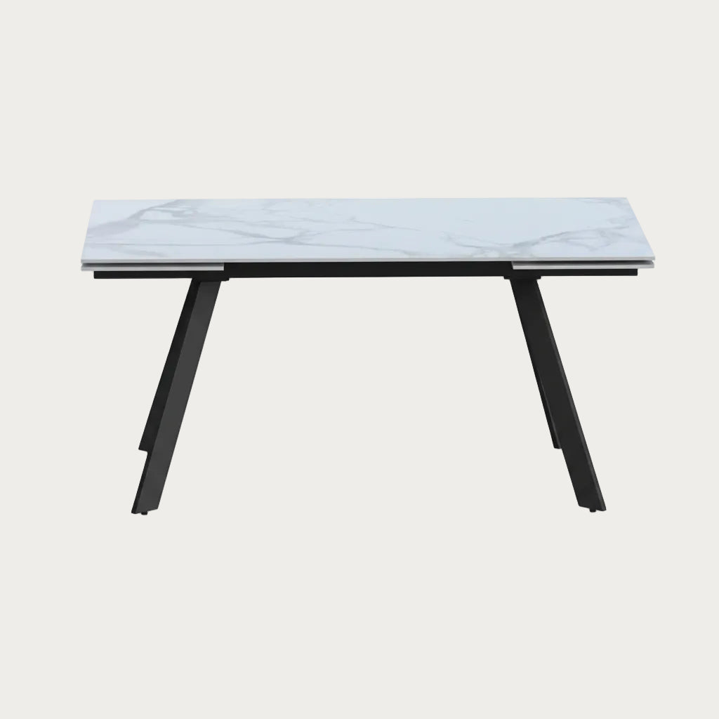 Alexandra Table with marble-like top and black legs on a white background