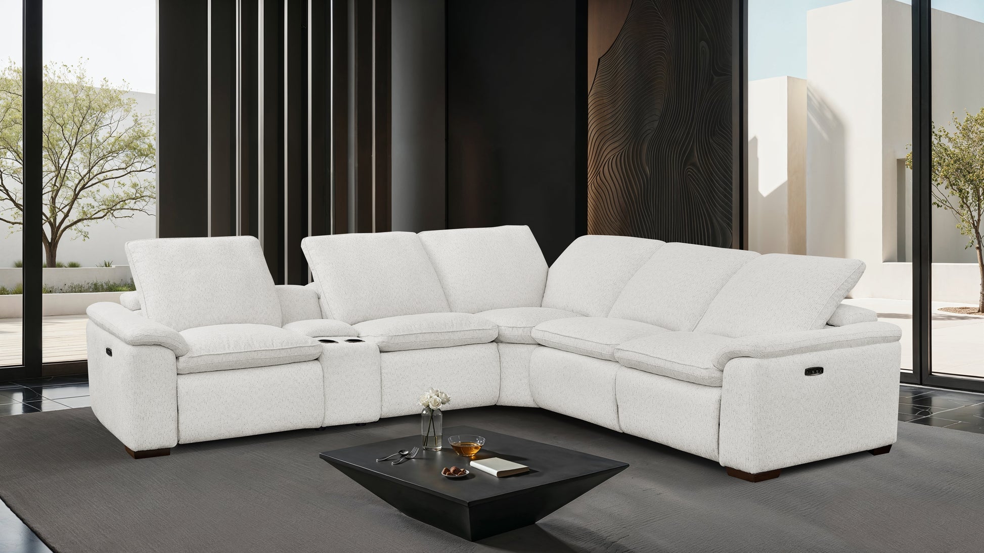 Cloudy white sectional sofa in a modern living room with a coffee table.