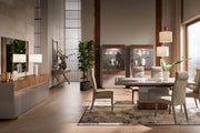 Corso Como modern dining room set with a table, chairs, curios, and decorative elements.