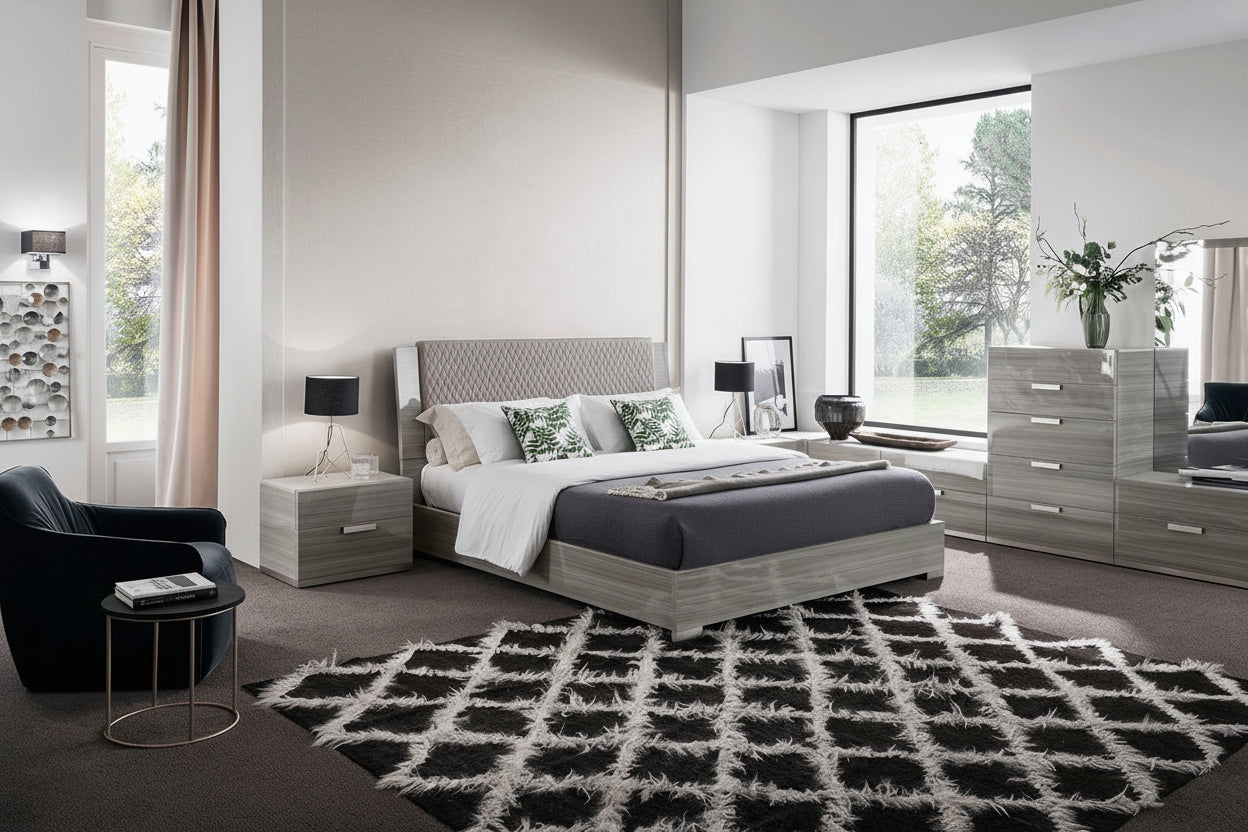 The Iris modern bedroom set with a gray bed, nightstands, and a large mirror.