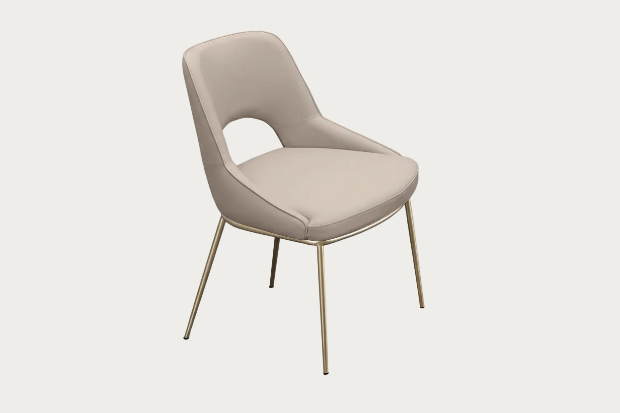 Amelia beige chair with champagne finish legs on a white background