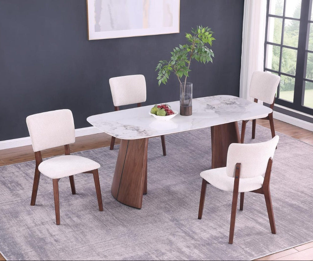 Anna dining room set with a marble table and chairs in a well-lit room.