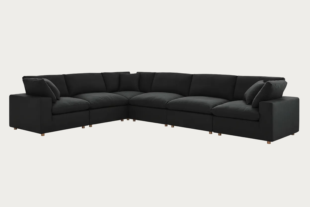 Black sectional sofa on a white background