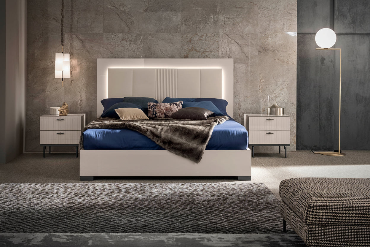Claire modern bedroom set with a large bed, nightstands, and decorative items.