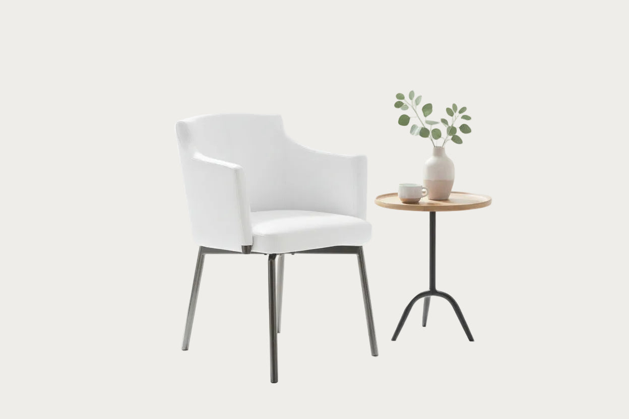 Dusty white armchair with black metal legs on a white background