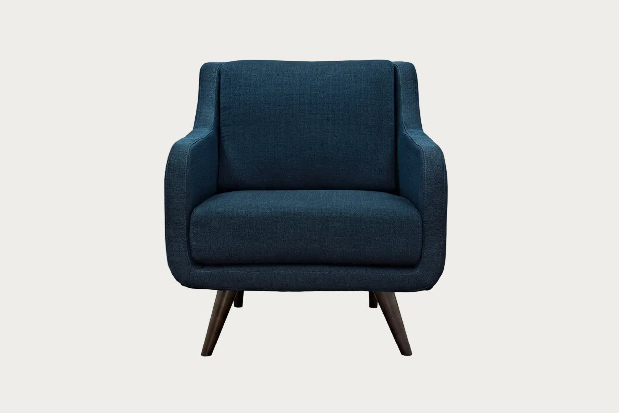 Verve Azure fabric armchair with wooden legs on a white background.
