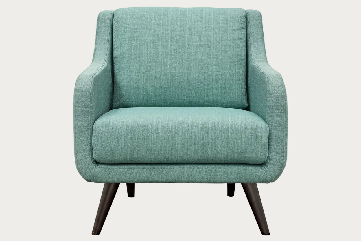 Verve Lagun fabric armchair with wooden legs on a white background.