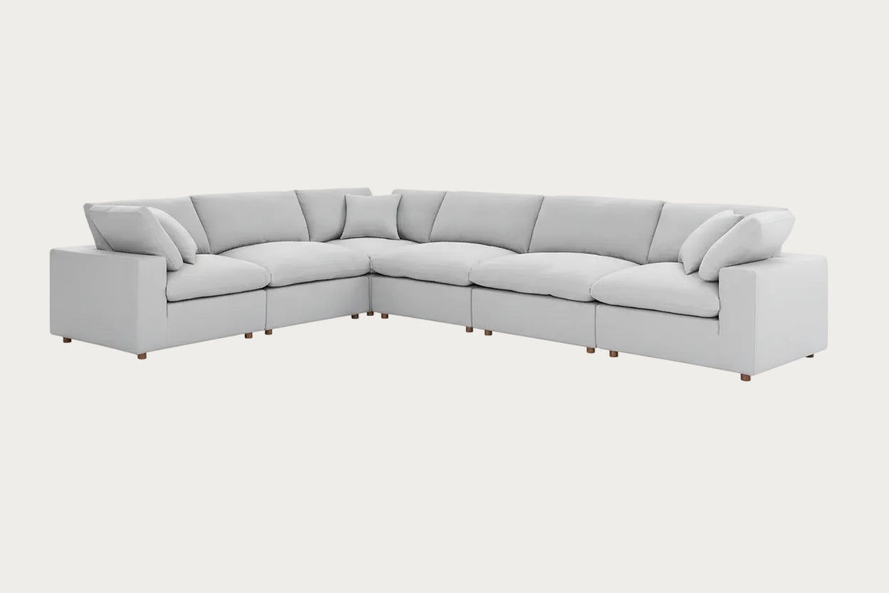 Light gray sectional sofa on a white background.
