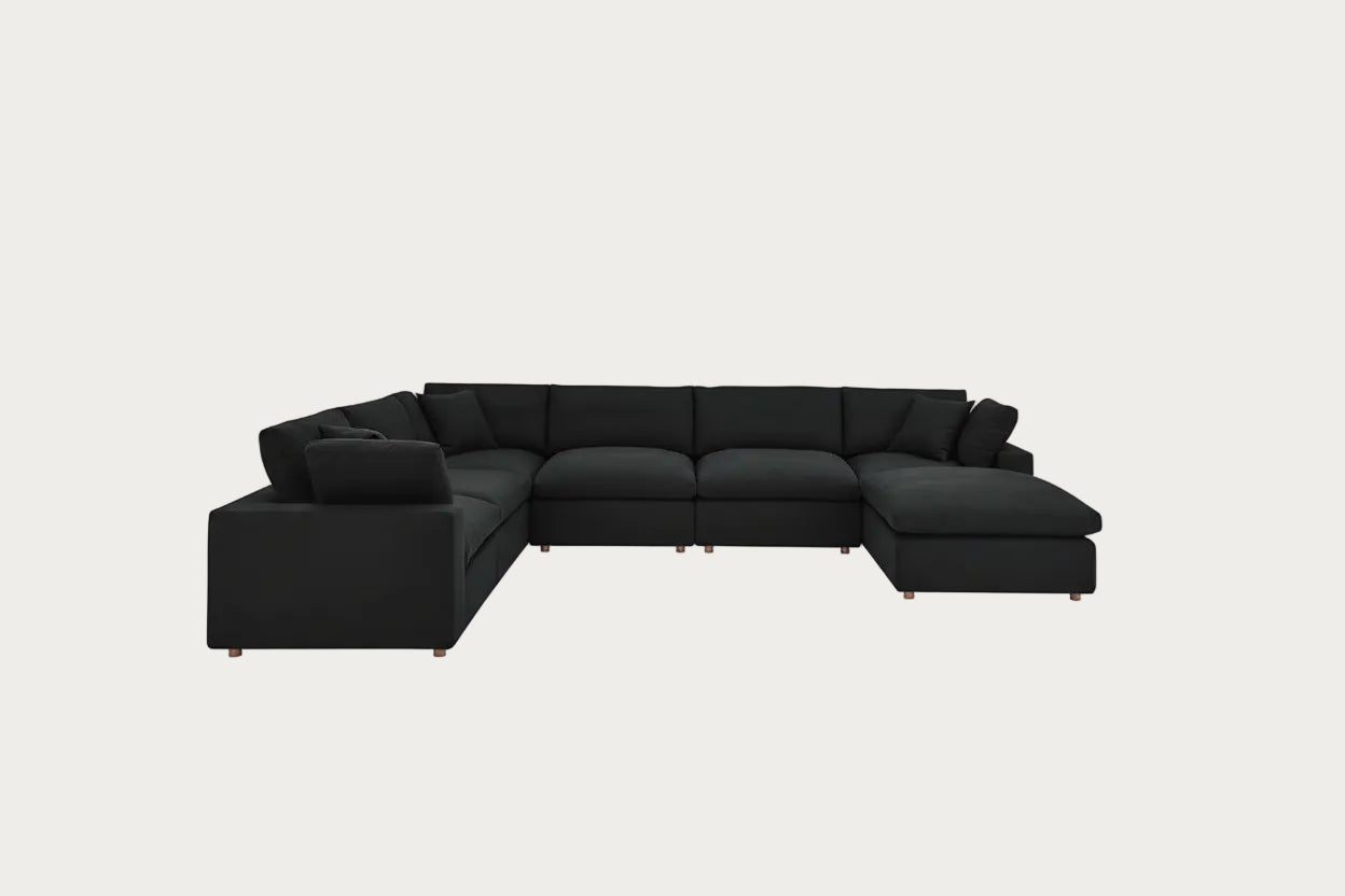 Black sectional sofa on a white background
