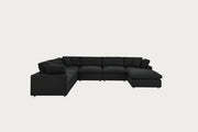 Black sectional sofa on a white background
