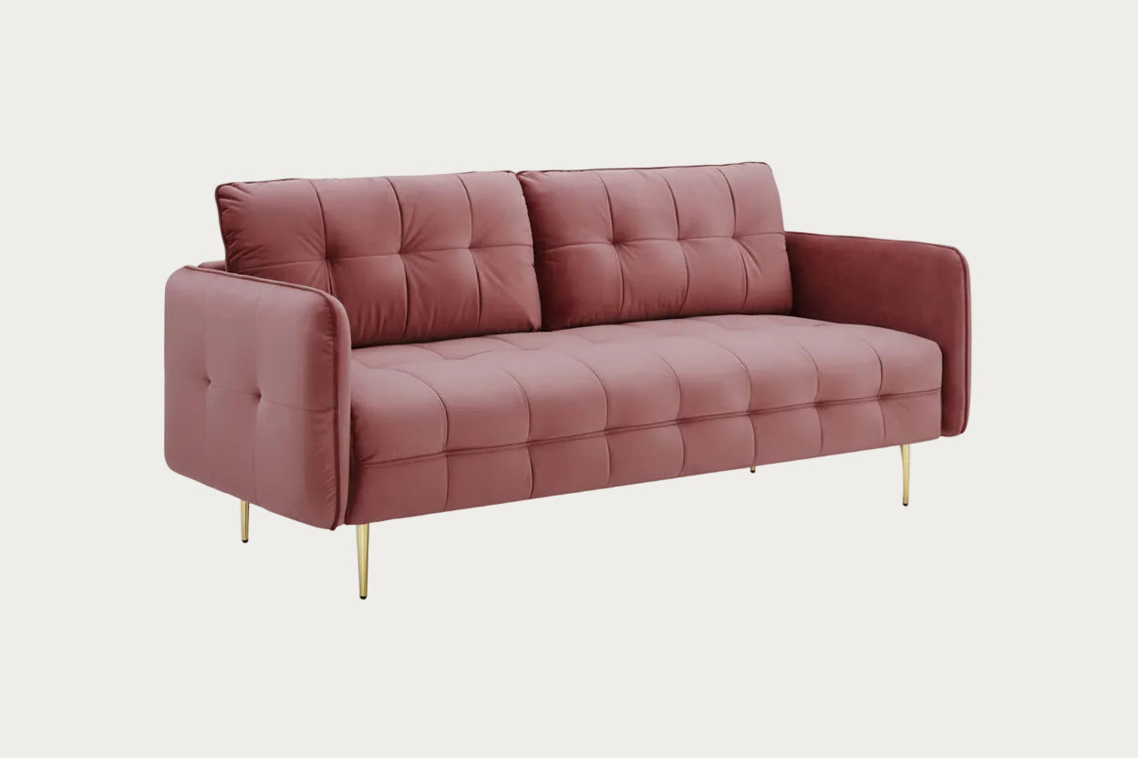 Pink sofa with gold legs on a white background