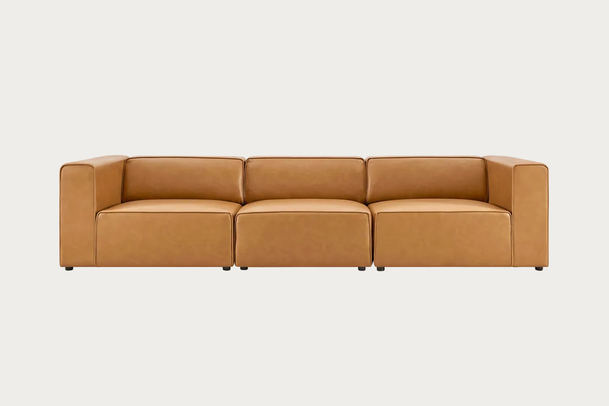 Brown leather sectional sofa on a white background