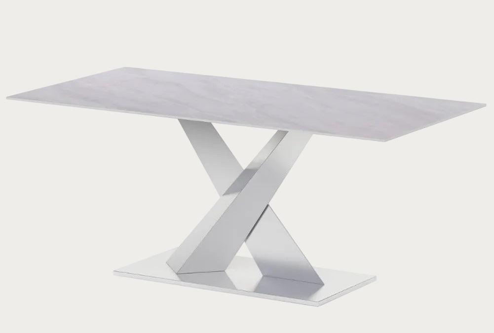 Jennifer dining table with a white marble-like finish.