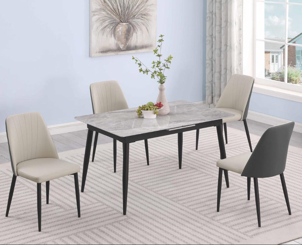 Judith dining room set with a table and four chairs in a well-lit room.