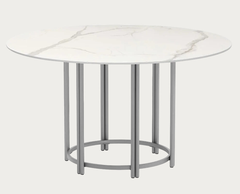 Kamila round marble table with a white marbled surface.
