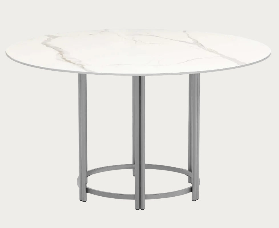 Round marble table with a white marble top and metal base on a white background