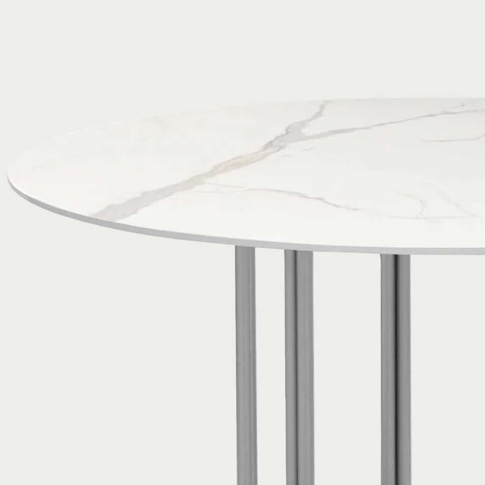 Kamila round marble table with white and gray pattern.
