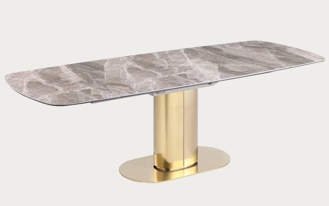 Karla dining table with marble top and gold base.