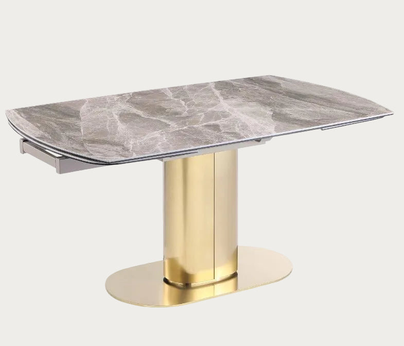 Karla extendable dining table with marble top and gold base.