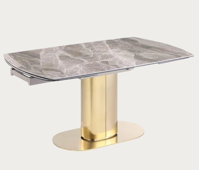Karla dining table with marble top and gold base.