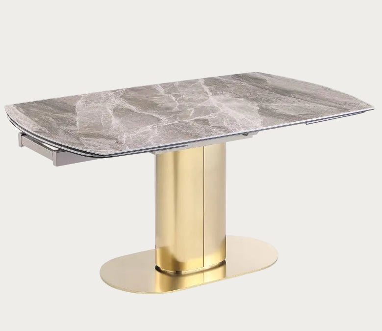 Karla dining table with marble top and gold base.