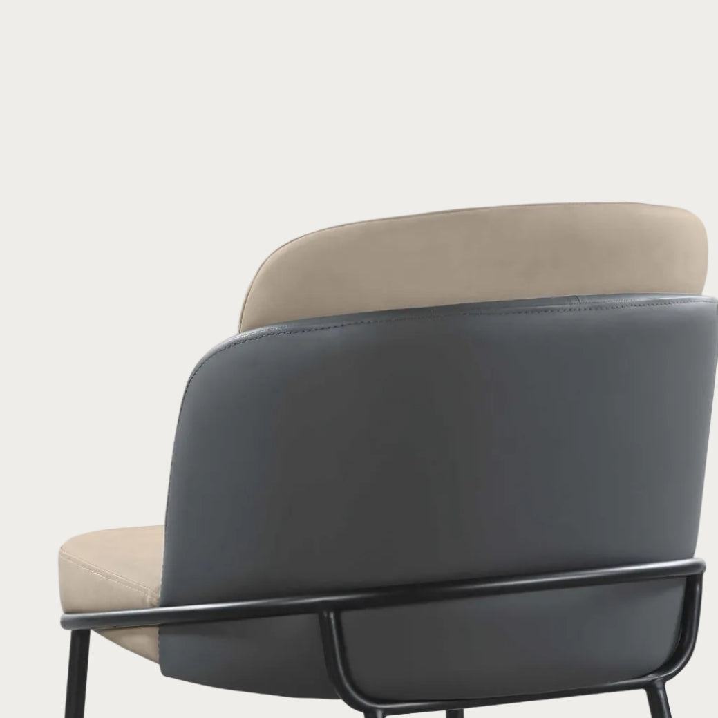 Modern chair with black backrest and beige seat on a white background
