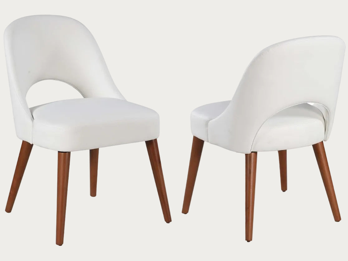 The Rosario white chairs with wooden legs.