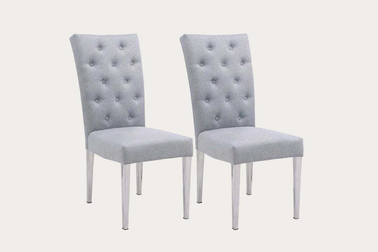 Two Kerry gray fabric upholstered chairs with tufted backrests on a white background