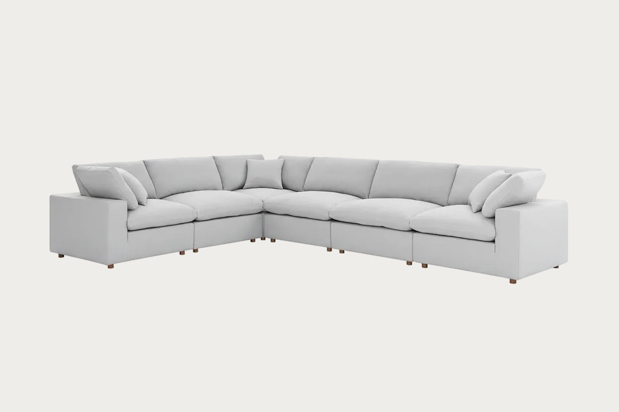Light gray sectional sofa on a white background.