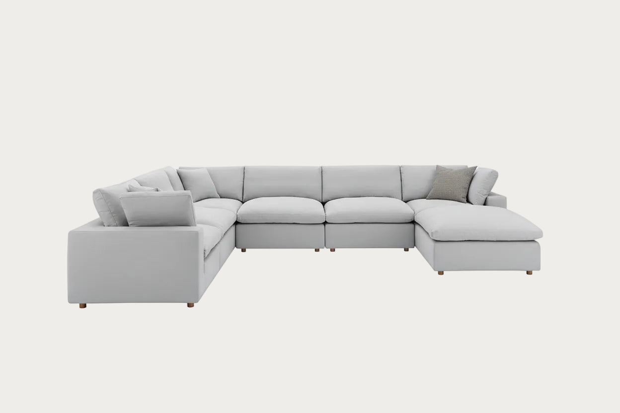 Light gray sectional sofa on a white background.