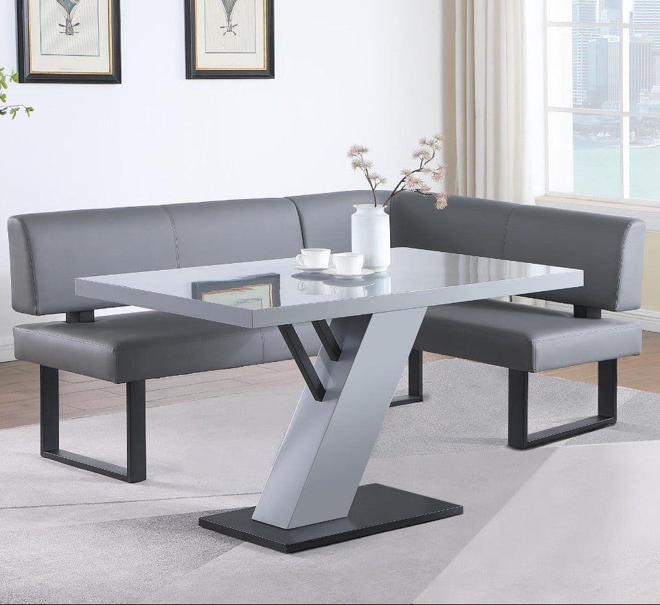 Linden gray dining set with bench and table in a room with large windows.