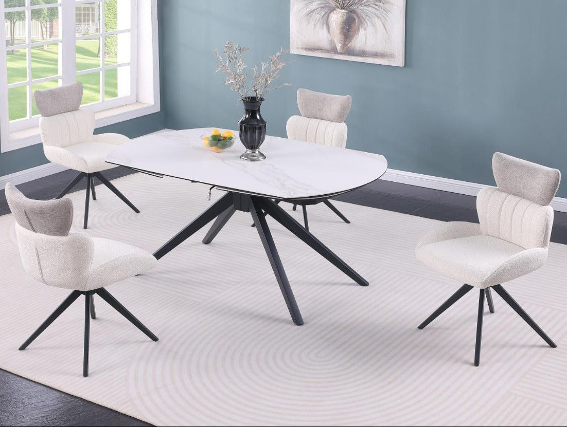 Nicole dining room set with a white table and chairs in a room with a window and wall art.