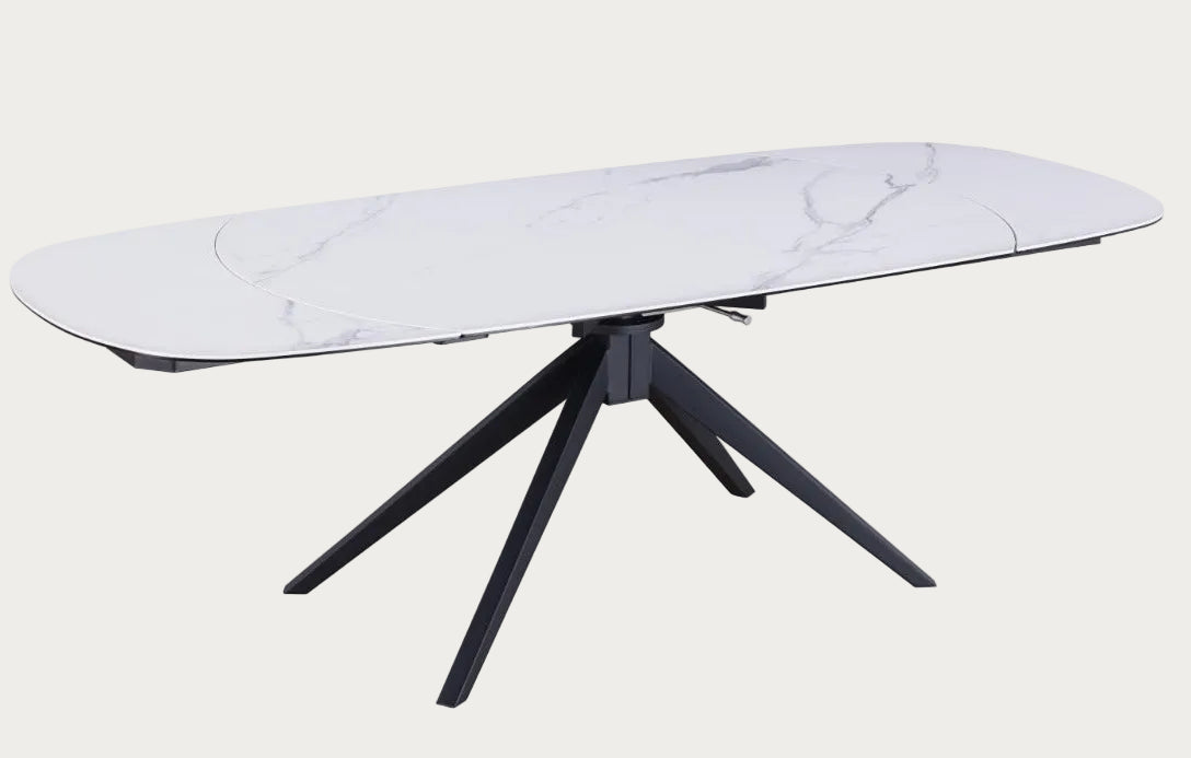 Nicole modern dining table with white marble-like top and black metal legs on 