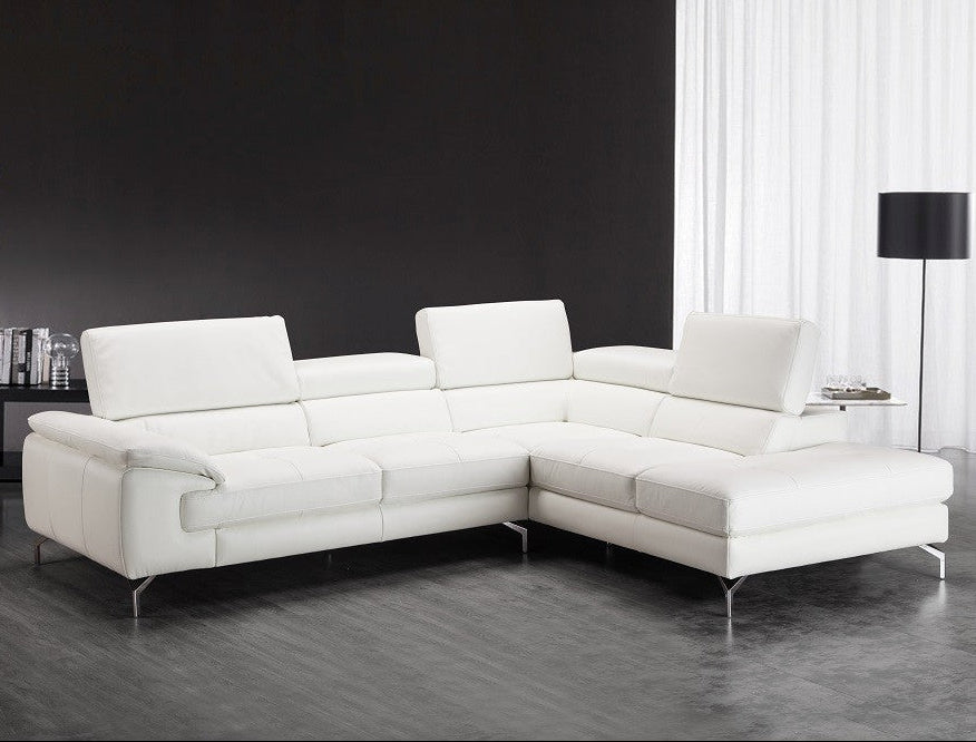 Nila white leather sectional sofa in a modern living room setting.