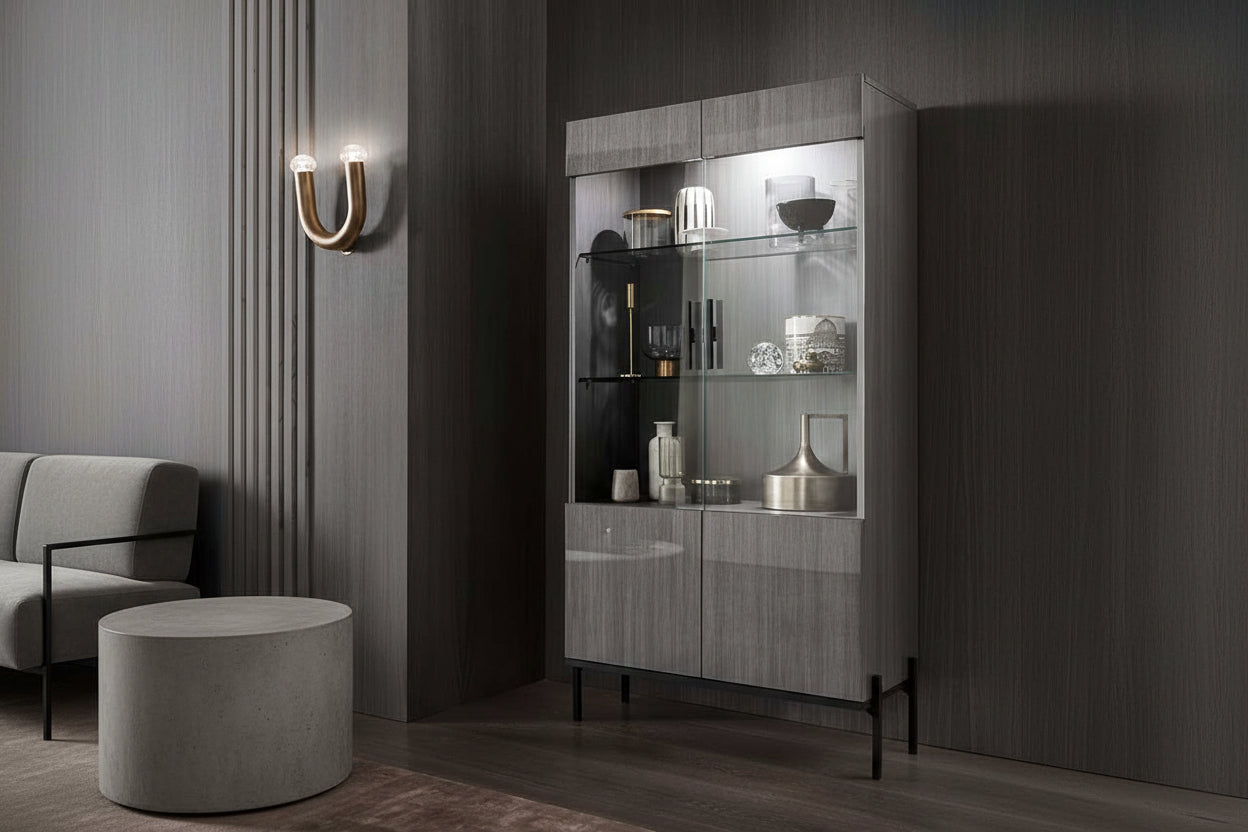 Novecento display cabinet with glass shelves in a room with dark walls and a wooden floor.