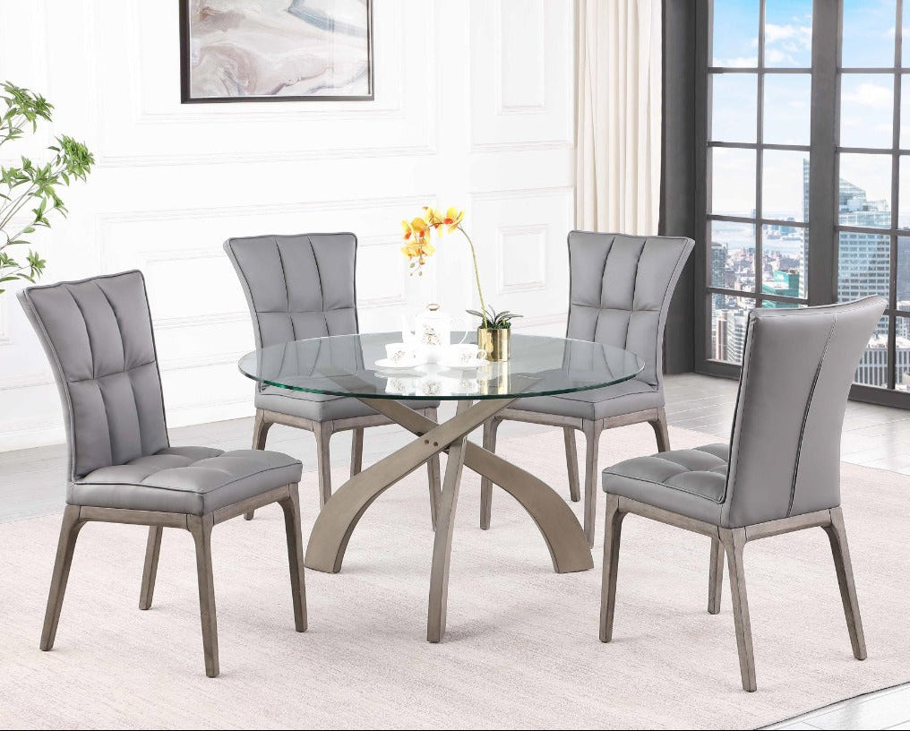 Dining room set with glass table and gray chairs in a modern living room.
