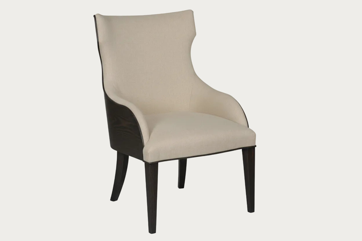 American Drew Emporium beige upholstered chair with wooden legs on a white background